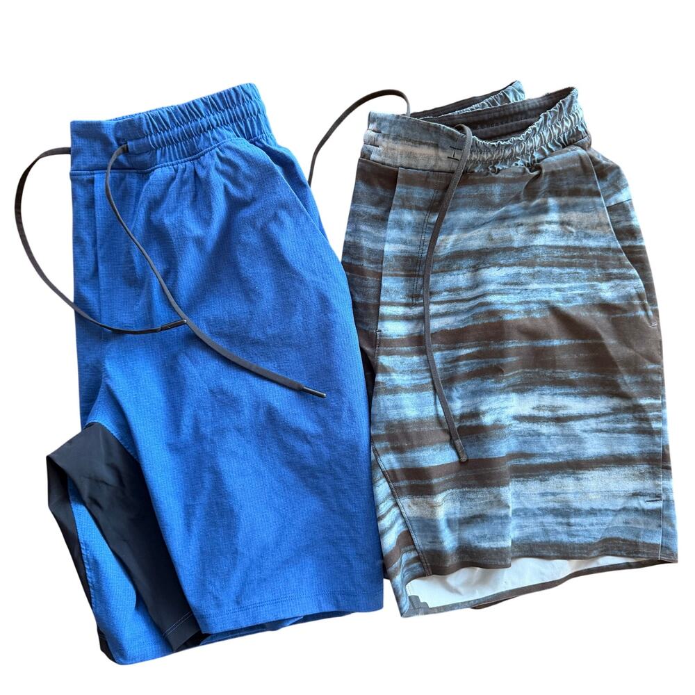 2 pairs Lululemon men’s Medium shorts blue and blue/black pattern pockets